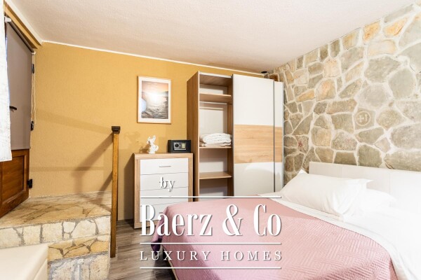 photo 12 Omiš, Stanići, a beautiful house with a sea view, total living area of 160 m² on a land plot of 2546